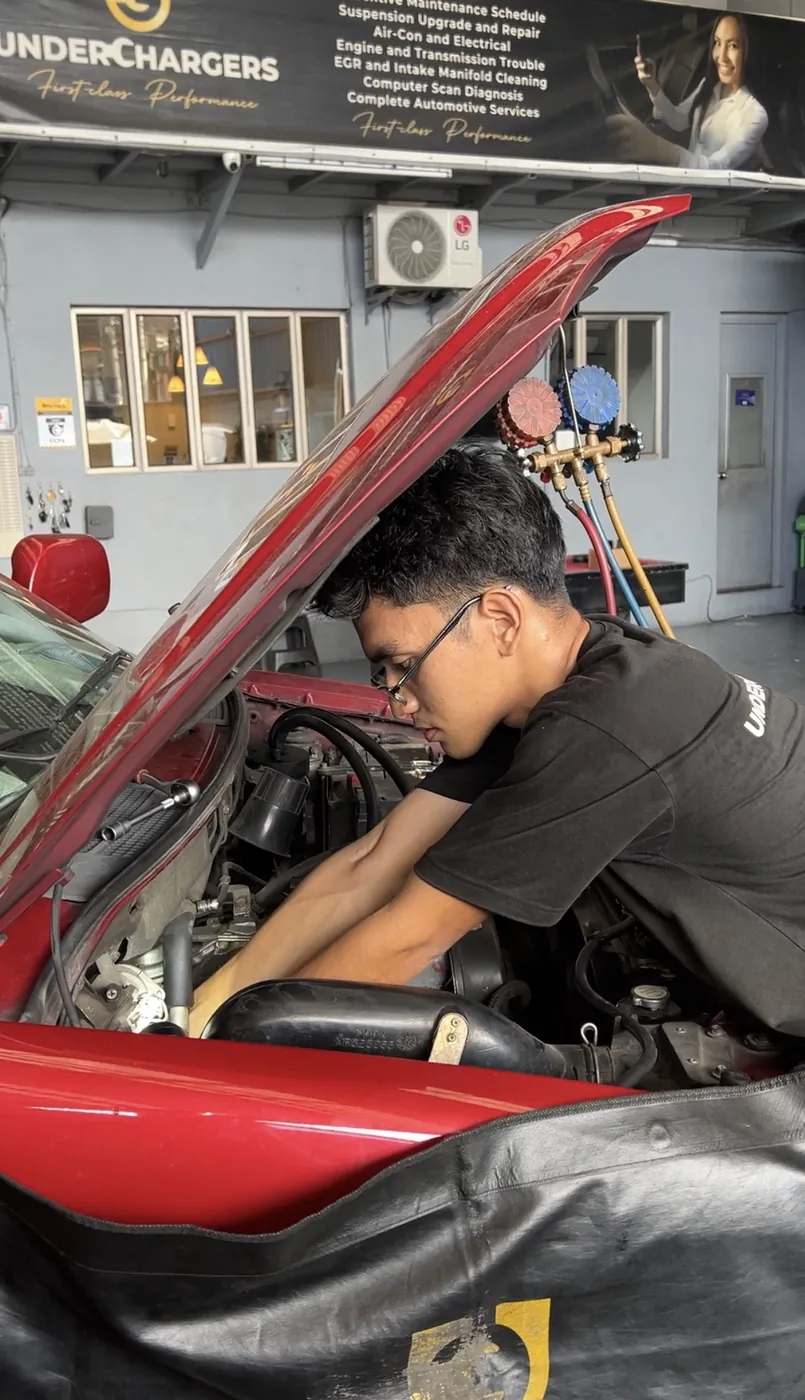 Engine service in progress on a Mitsubishi Adventure